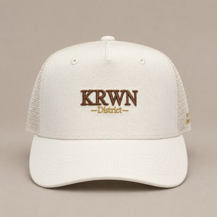 KRWN District Trucker Cap — Rule the District '26, front view with KRWN District embroidery and mesh panels
