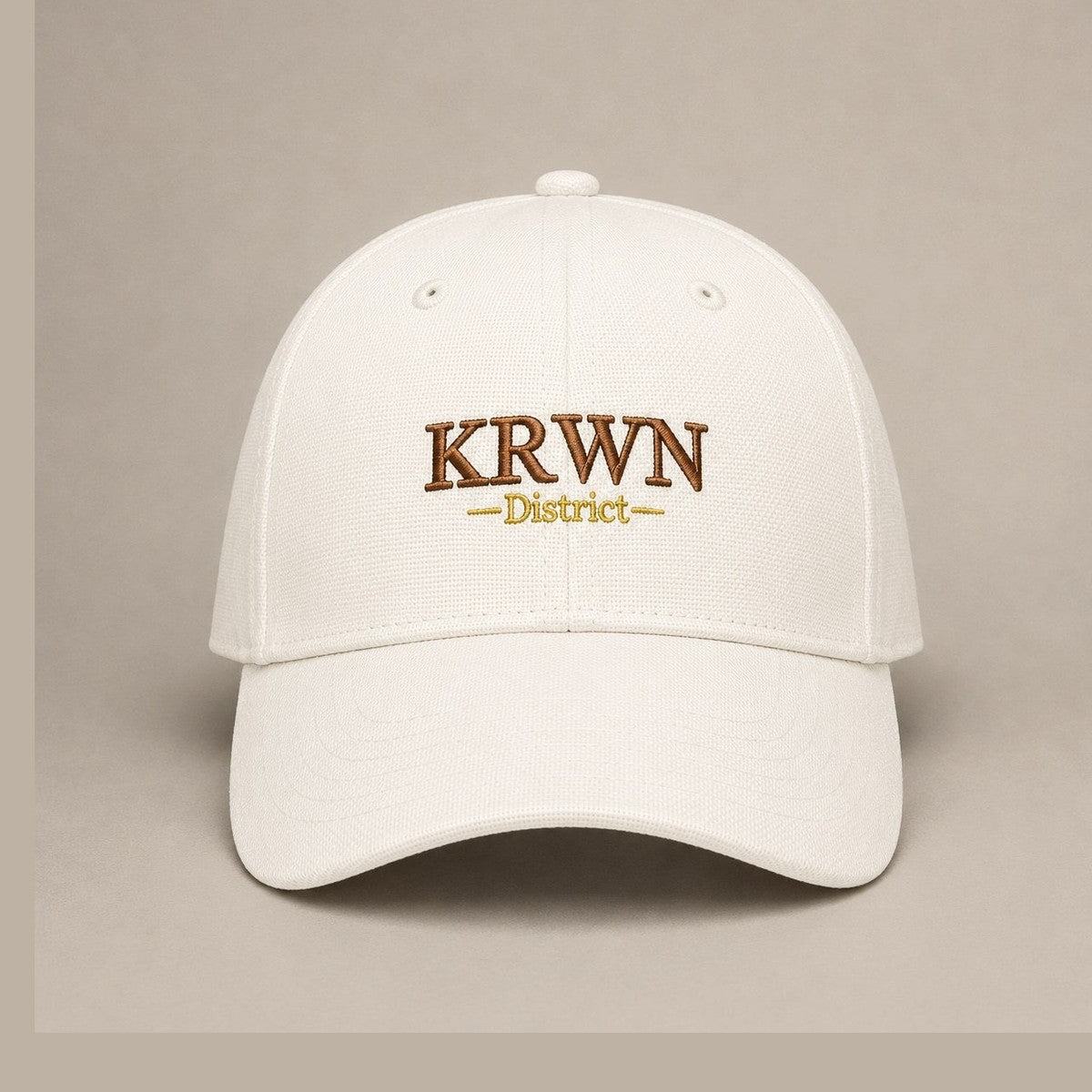 KRWN District Baseball Cap — Rule the District '26, front view with KRWN District embroidery on cream cotton canvas