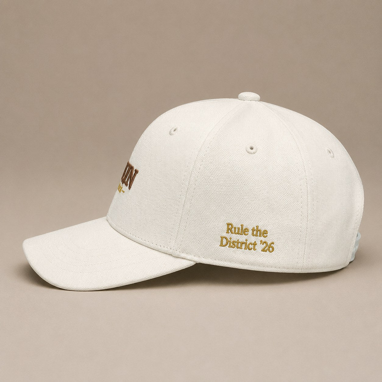 KRWN District Baseball Cap — side view with gold Rule the District '26 embroidery