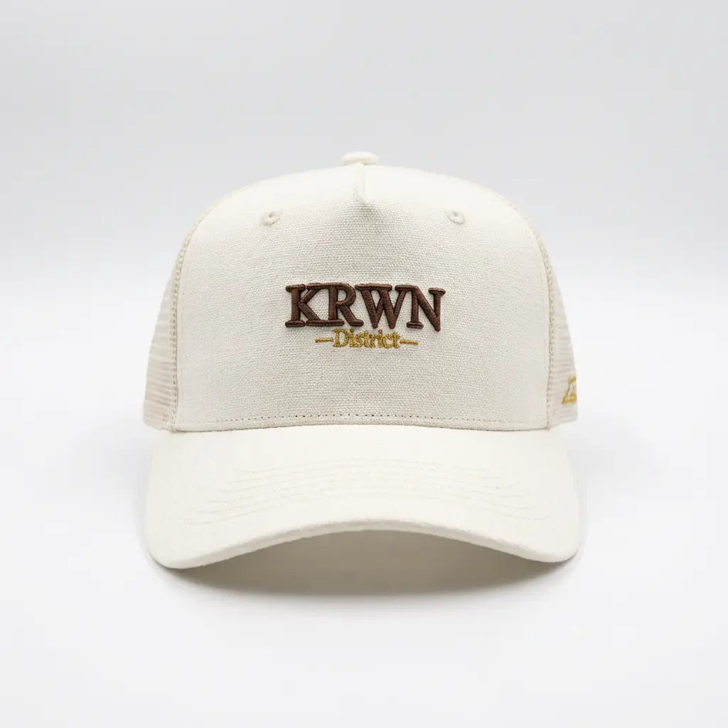 Premium Trucker Cap Beige, Front View — KRWN District Rule the District '26