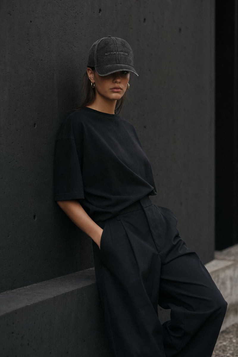 The Code Washed Black — editorial look, dark concrete